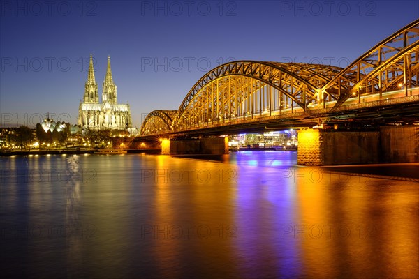 Cologne Cathedral with Hohenzollern Bridge over the Rhine