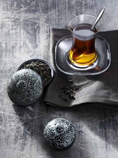 Tea in glass on gray napkin