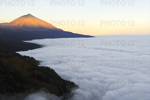 Pico del Teide at sunrise over trade wind clouds