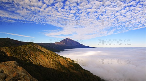 Pico del Teide at sunrise over trade wind clouds