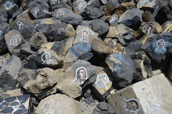 Pictures of famous musicians painted on stones