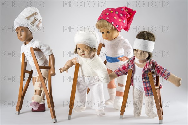 Four dolls walking