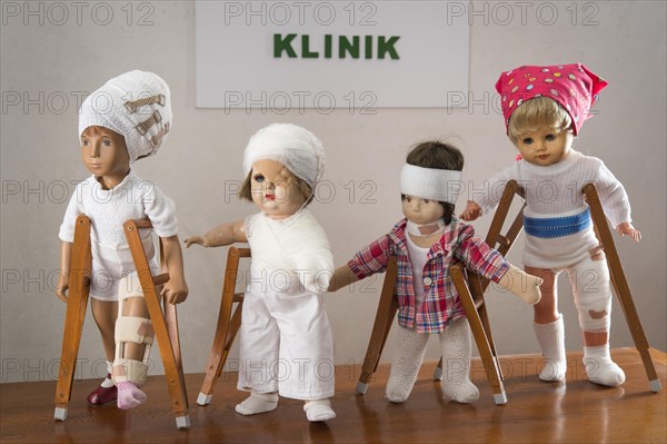 Four dolls walking