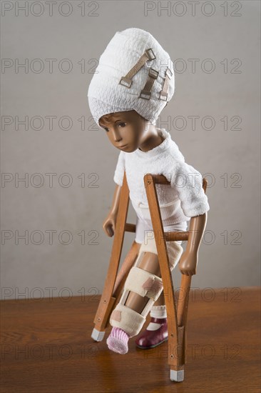 Doll with bandaged head