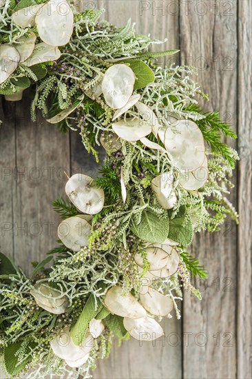 Autumn wreath on wooden wall