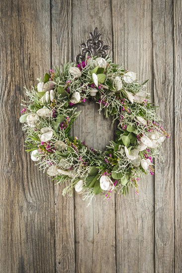 Autumn wreath on wooden wall