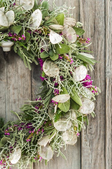 Autumn wreath on wooden wall