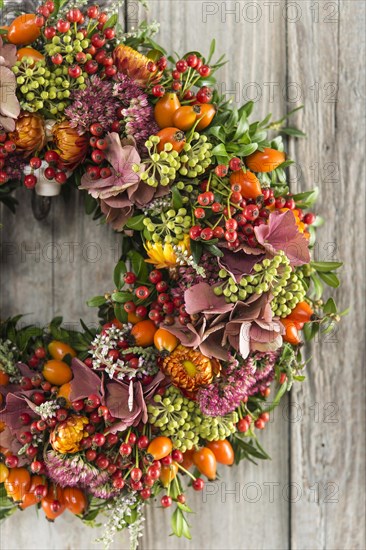 Autumn wreath cutout on wooden wall