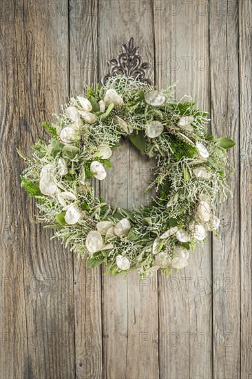 Autumn wreath on wooden wall