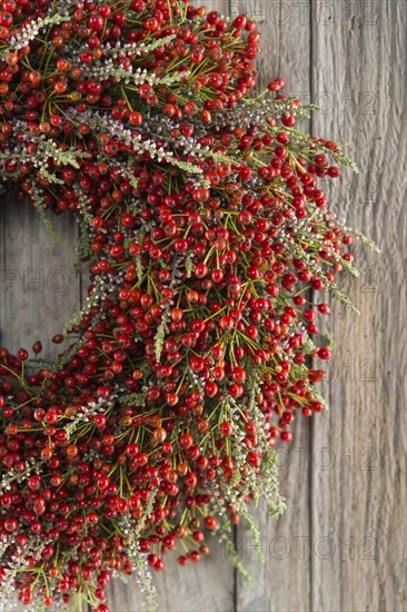 Autumn wreath on wooden wall cutout