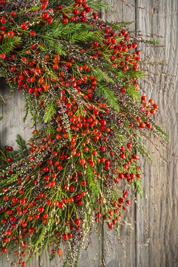 Autumn wreath on wooden wall cutout