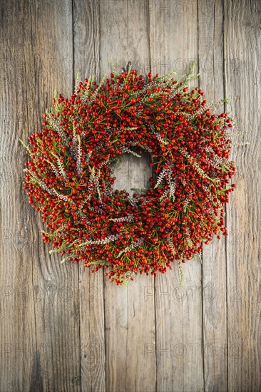 Autumn wreath on wooden wall