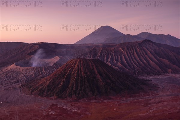 Volcanic pipes with smoking volcano Gunung Bromo