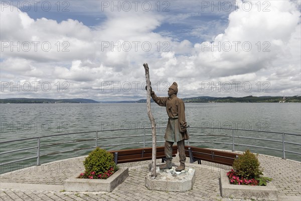 Statue of a pile builder at the shipping pier Unteruhldingen