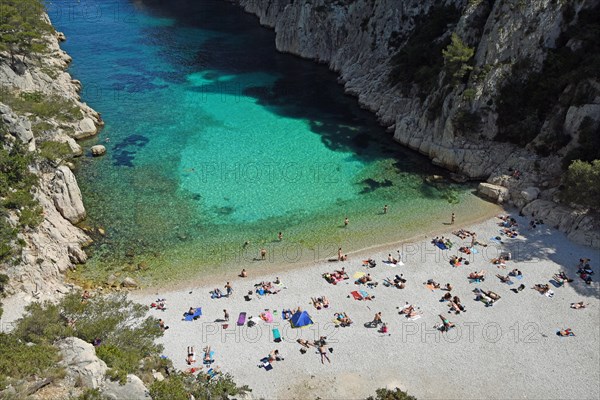 Tourists at beach with turquoise water