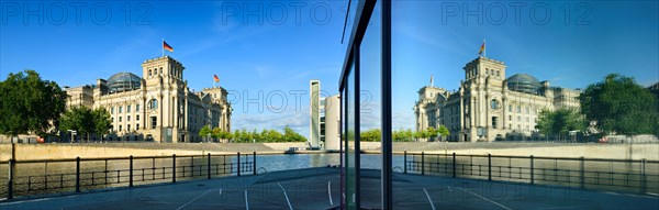 Reichstag reflected in glass facade of Marie-Elisabeth-Luders-Haus