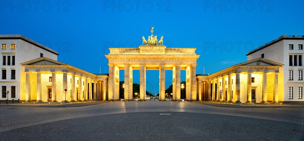 Pariser Platz with illuminated Brandenburg Gate at dawn