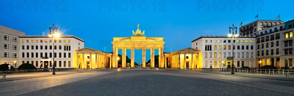 Pariser Platz with illuminated Brandenburg Gate at dawn