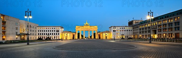 Pariser Platz with illuminated Brandenburg Gate at dawn