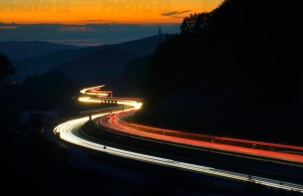 A3 motorway meanders through low mountain range landscape