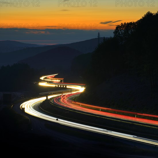 A3 motorway meanders through low mountain range landscape