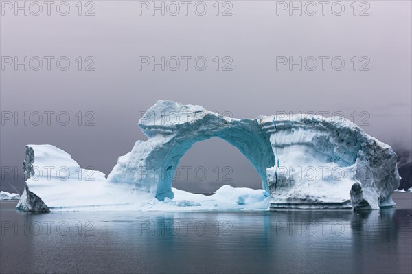 Ice bow in Scoresbysund at dawn