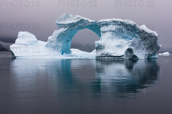 Ice bow in Scoresbysund at dawn