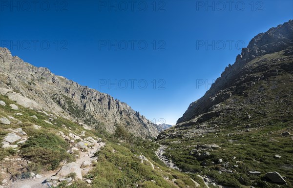 Restonica river flows at its source through mountain valley