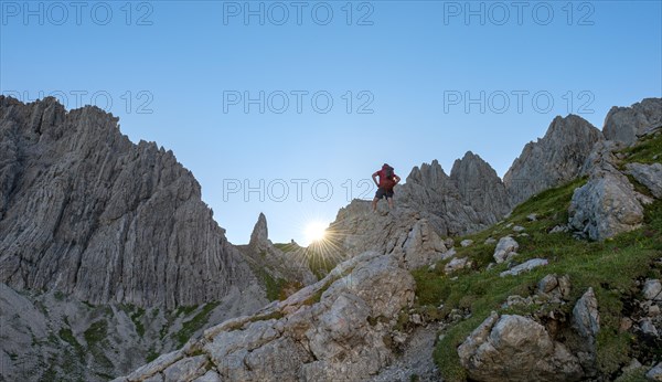 Hiker stands on a rock