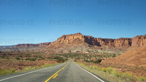 Red rugged sandstone cliffs on Highway 24