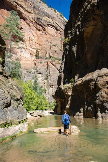 Hiker walks in the water