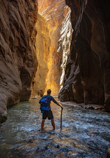 Hiker walks in the water