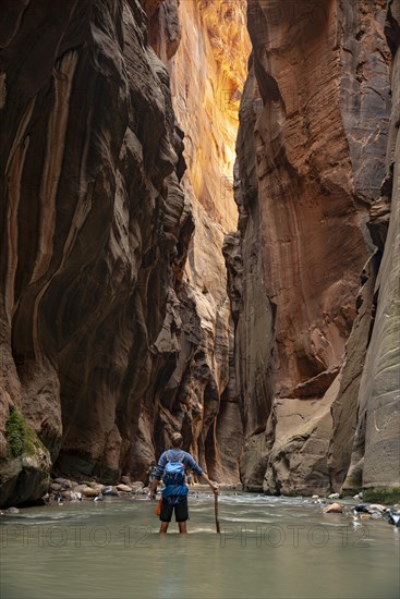 Hiker walks in the water