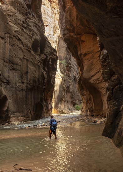 Hiker walks in the water