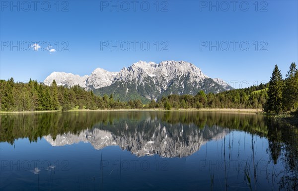 Western Karwendelspitze is reflected in Lake Luttensee