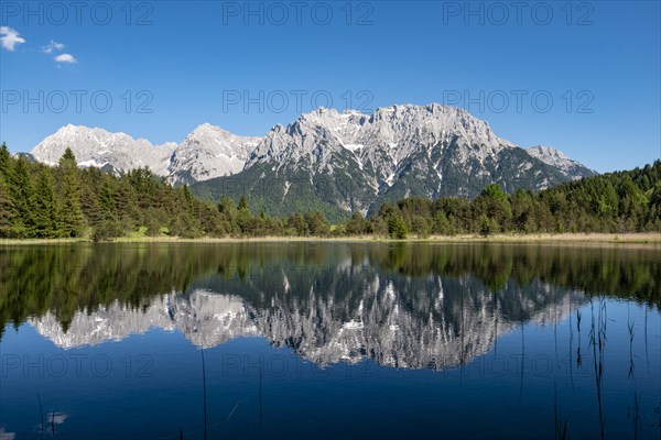 Western Karwendelspitze is reflected in Lake Luttensee