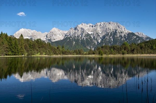 Western Karwendelspitze is reflected in Lake Luttensee