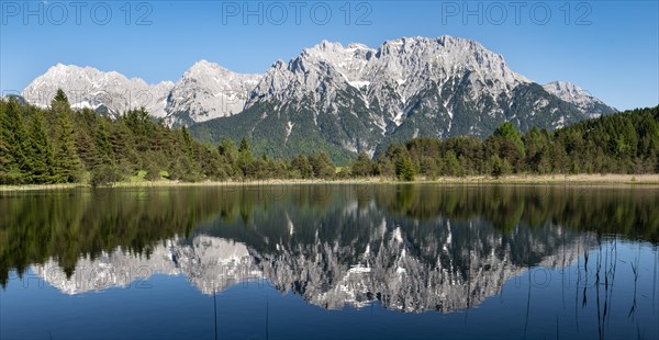 Western Karwendelspitze is reflected in Lake Luttensee