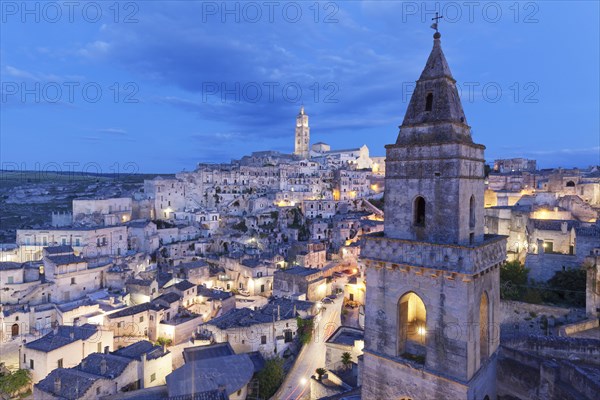 View of Church of San Pietro Barisano and Sasso Barisano historic centre with cathedral at dusk