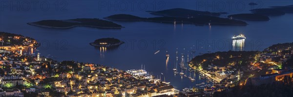 Town view Hvar with harbour and Pakleni islands at night