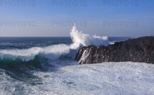 Surf at rocky coast