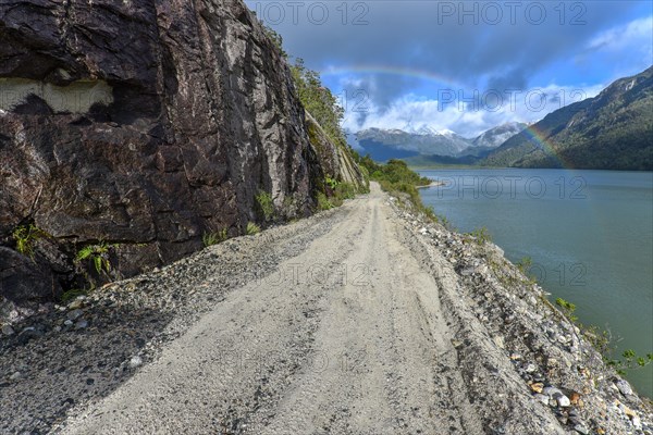 Gravel road with rainbow near Puerto Rio Tranquilo