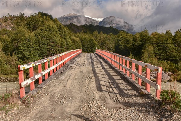 Simple wooden bridge at Mirador Glaciar Exploradores over Rio Exploradores at Puerto Rio Tranquilo