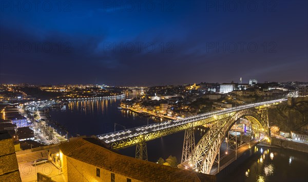 View over Porto with illuminated Ponte Dom Luis I Bridge across River Douro