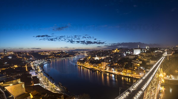 View over Porto with illuminated Ponte Dom Luis I Bridge across River Douro
