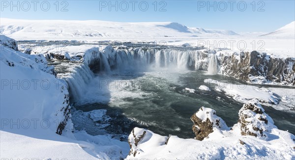 Gooafoss Waterfall in winter with snow and ice