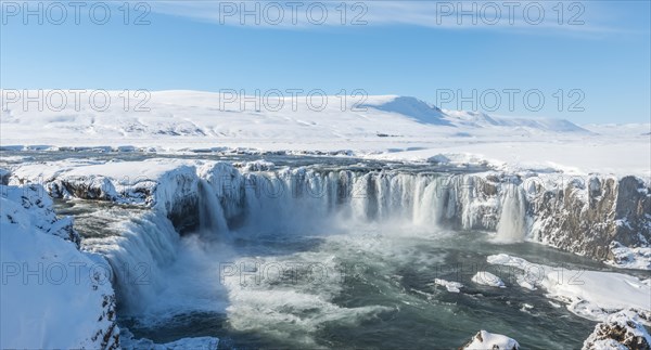 Gooafoss Waterfall in winter with snow and ice