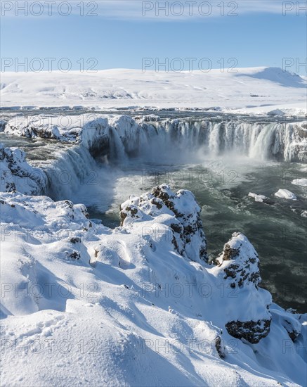 Gooafoss Waterfall in winter with snow and ice