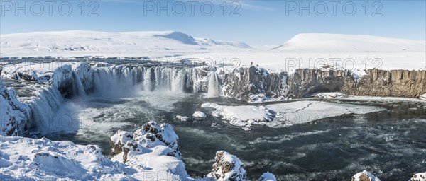 Gooafoss Waterfall in winter with snow and ice