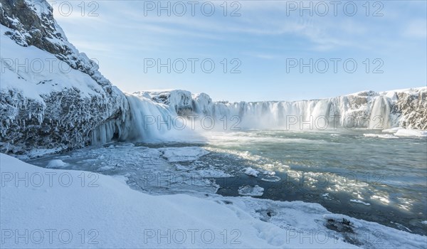 Gooafoss Waterfall in winter with snow and ice